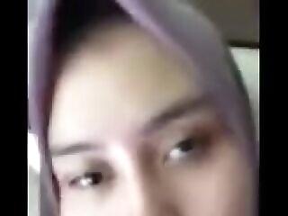 japanese muslim schhol woman demonstrating her muff by webcam